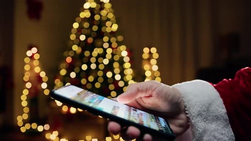 Santa Looking for Photos on His Smartphone