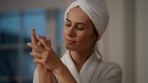 Calm Model Creaming Hands Home Close Up Resting Lady Applying Cream at Evening