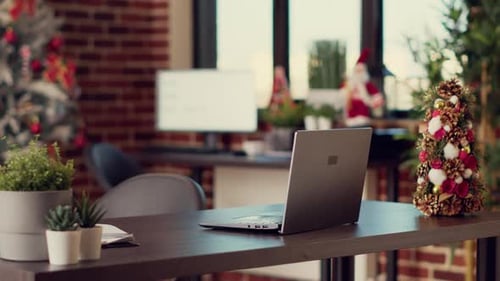 Startup Office with Laptop and Christmas Decorations