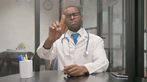 Doctor Making a Point in an Office