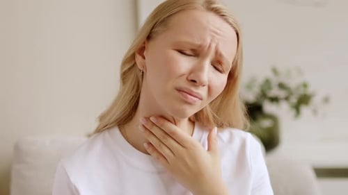 Woman Suffering From Sore Throat, Medical Emergency
