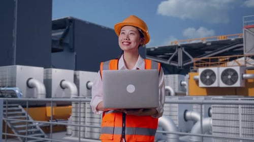 Asian Female Engineer Working On A Laptop On Rooftop HVAC