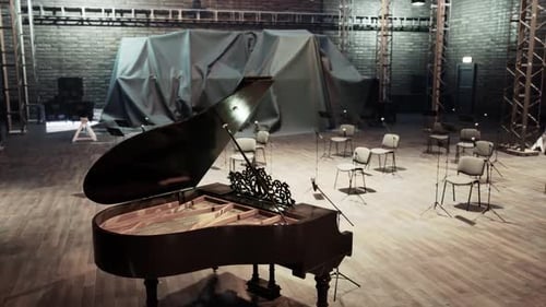 An Elegant Grand Piano Set Up in a Historic Opera House Rehearsal Hall