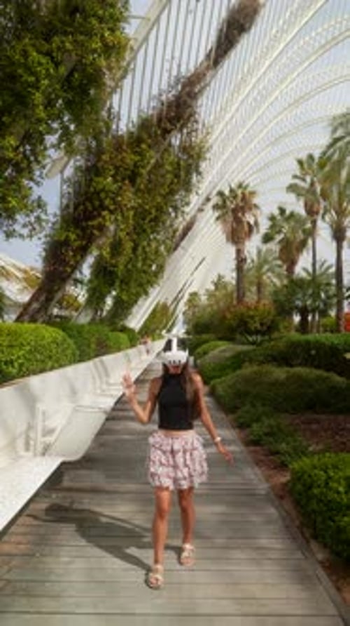 Woman Using VR Headset Walking in Urban Area