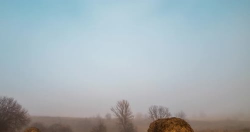 Mountain Meadow Timelapse at the Autumn Sunrise Time Wild Nature and Rural Haystacks on Grass Field