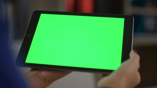 African american woman hands use tablet computer chroma key in home office