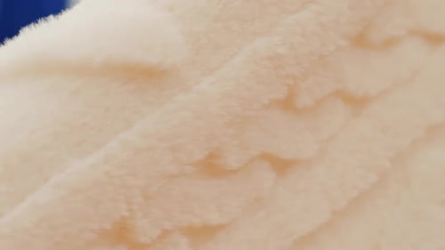 Close View of Textured Orange and White Striped Fabric Great for Sewing and Fashion Design Projects