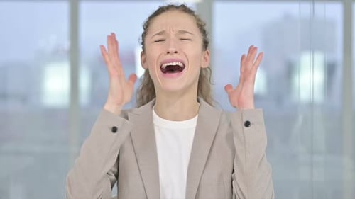 Distressed Woman Yelling with Arms Raised