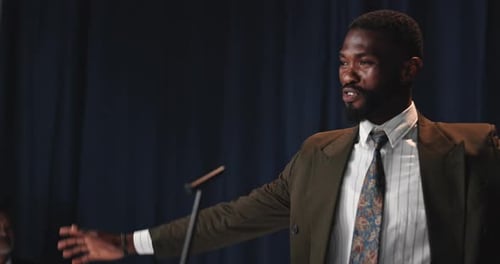 Young Adult Giving Corporate Speech at Podium