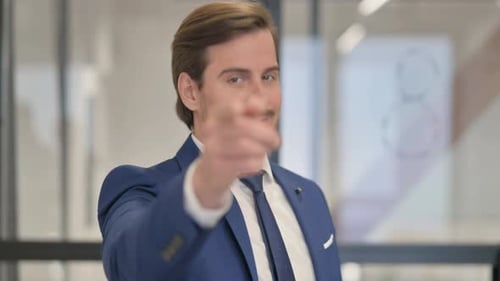Portrait of Young Businessman inviting People