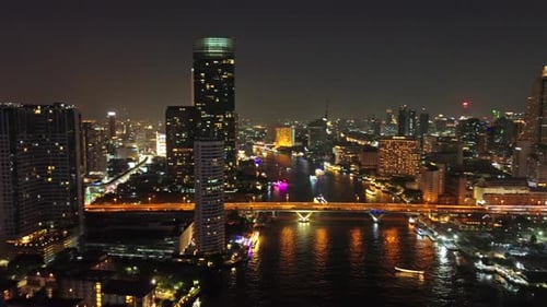 Skyscrapers in Bangkok City and River at Night