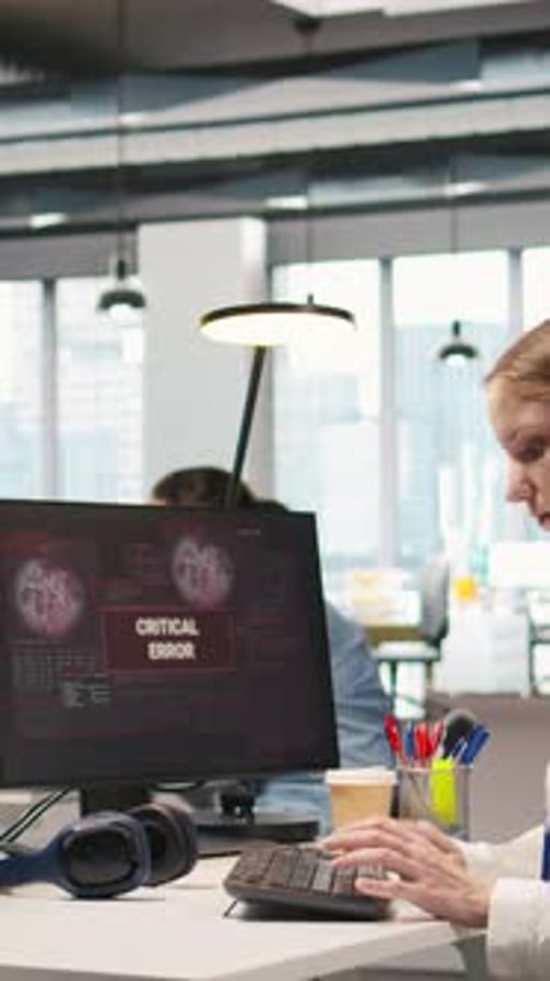 Vertical Video Young Inexperienced Developer in Office Struggling to Fix Critical Error