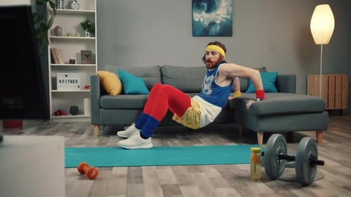 Engaging in a Home Workout While Wearing Vibrant Fitness Attire and Using Dumbbells