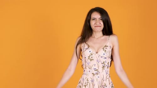 Young Woman Gives Thumbs Down Hand Gesture