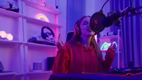 Caucasian audio DJ woman sing a song on microphone to broadcasting.