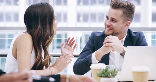 Business Team Meeting Ends with a Handshake