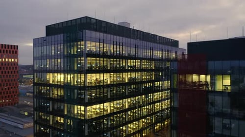 Aerial Panorama of LateNight Business Activity in a Glass Skyscraper