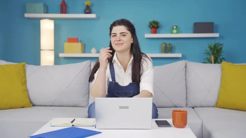 Woman making money sign with her hands.