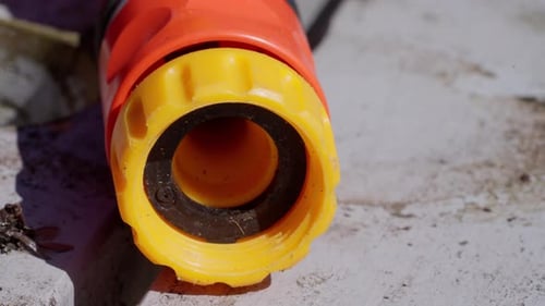 This is the end of a garden hose, It helps flowers and grass that grows
