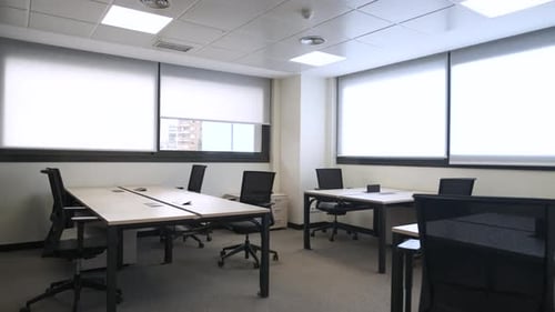 Interior of Spacious Office with Tables and Chairs