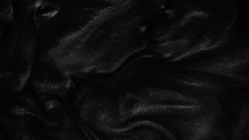 Abstract Swirling Black Liquid Texture Background