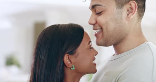 Loving Couple Embraces, Smiling Together Indoors