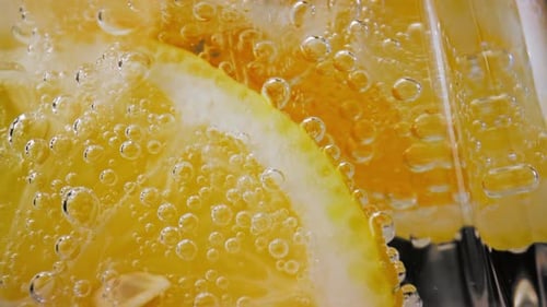 Close Up of Lemon Slices in Bubbly Water