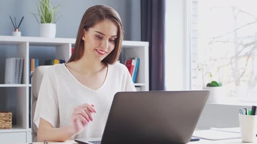 Young Woman Works at Home Office Using Computer Workplace of Female Entrepreneur Freelancer or