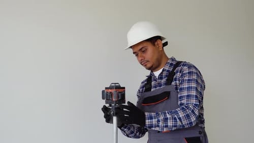 Indian Man Adjusting Laser Level Tool Laser Leveler Device