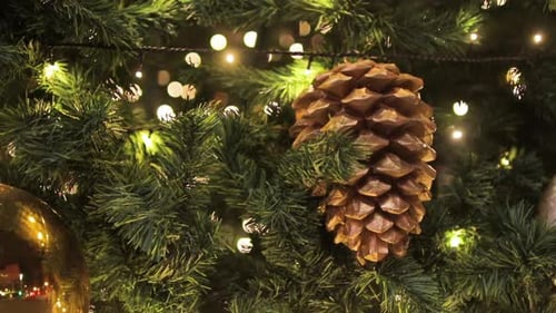 Festive Christmas Tree with Golden Decorations and Lights