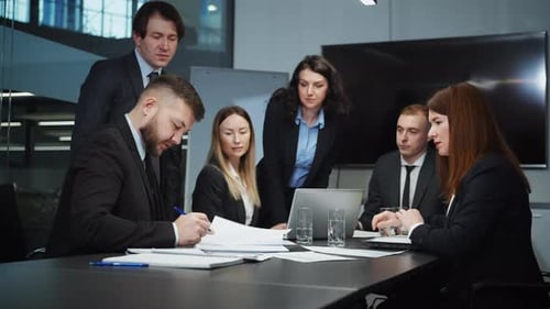 Business Team Meeting and Handshake in Office