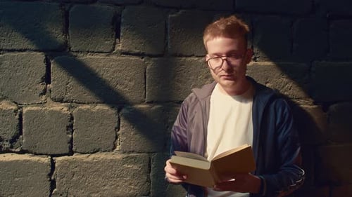 Young Man With Paperback Book Portrait
