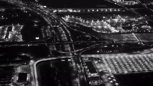 Aerial view of illuminated highway traffic road at night. cars driving freeway