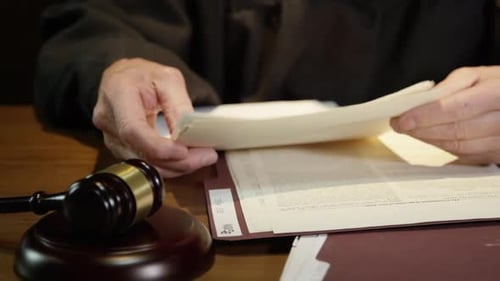 Judge going over documents in court HD