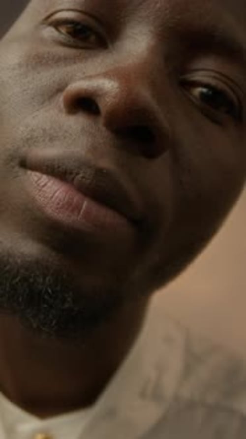 Vertical Closeup of Black Man with Sunflower Studio Portrait