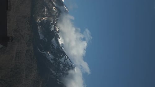 Timelapse of Clouds in Snowy Mountains in Winter or Spring Snowy Peaks of the Mountains in Autumn