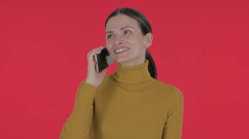 Woman Answering a Phone Call on a Smartphone