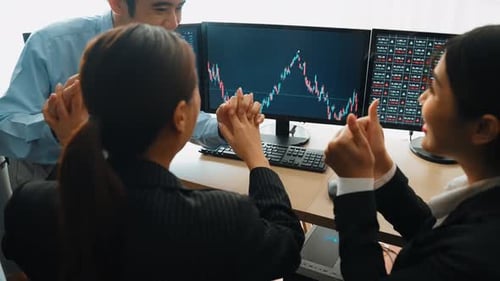 Business investors in stock company celebrate after make profit. Burgeoning