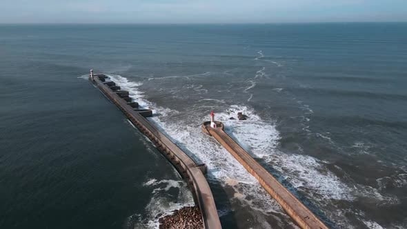 The ocean waves exploding in the lighthouse road., Buildings Stock ...