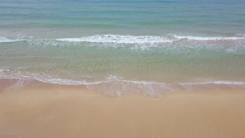 Beautiful empty beach with small waves - Aerial footage.