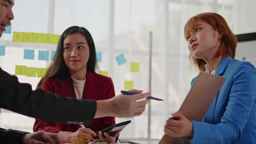 Business Team Collaborating on Project in Office