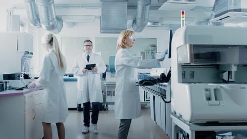 Medical Researchers Working in Advanced Laboratory