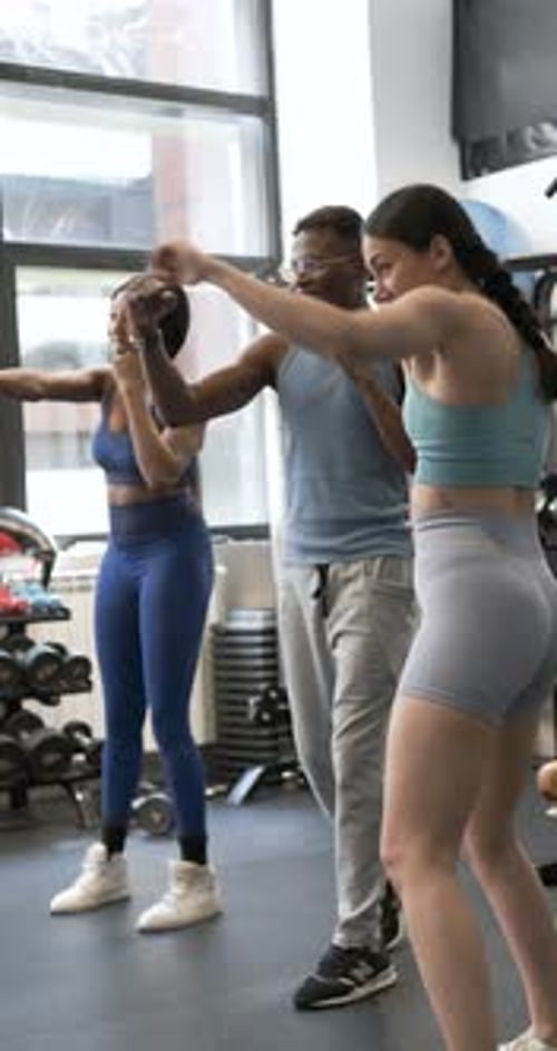 Instructor Giving a Fitboxing Class in a Gym