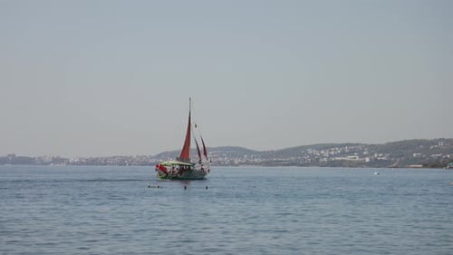Sailing Boat with Red Sails