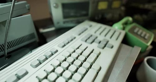 Vintage Computer Equipment and Retro Gadgets Displayed on a Workbench