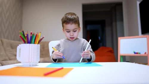 Child drawing creatively.