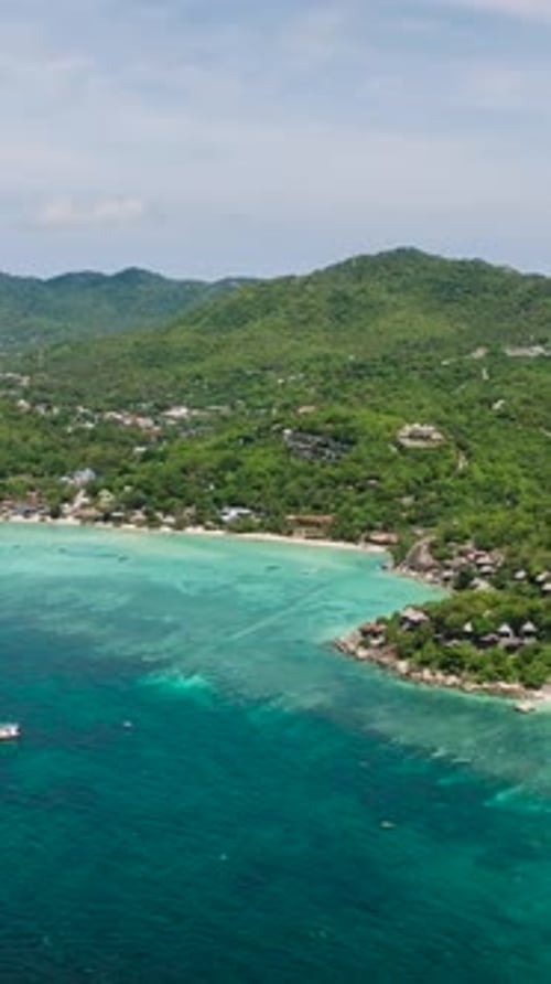 Idyllic Coastline with Turquoise Sea and Rocky Hill Koh Tao Thailand