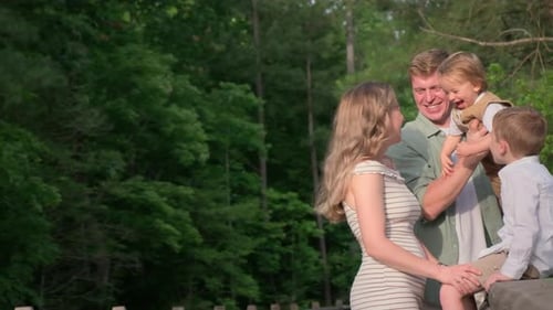 A Family Enjoys a Park Day Capturing Smiles and Warmth Together