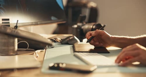 Creative Designer Using Graphics Tablet in Home Office