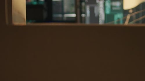 Person Coding in Dark Room with Mask and Hoodie